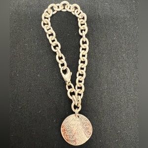 Tiffany and Co. silver notes 5th avenue round tag link bracelet 7.75”